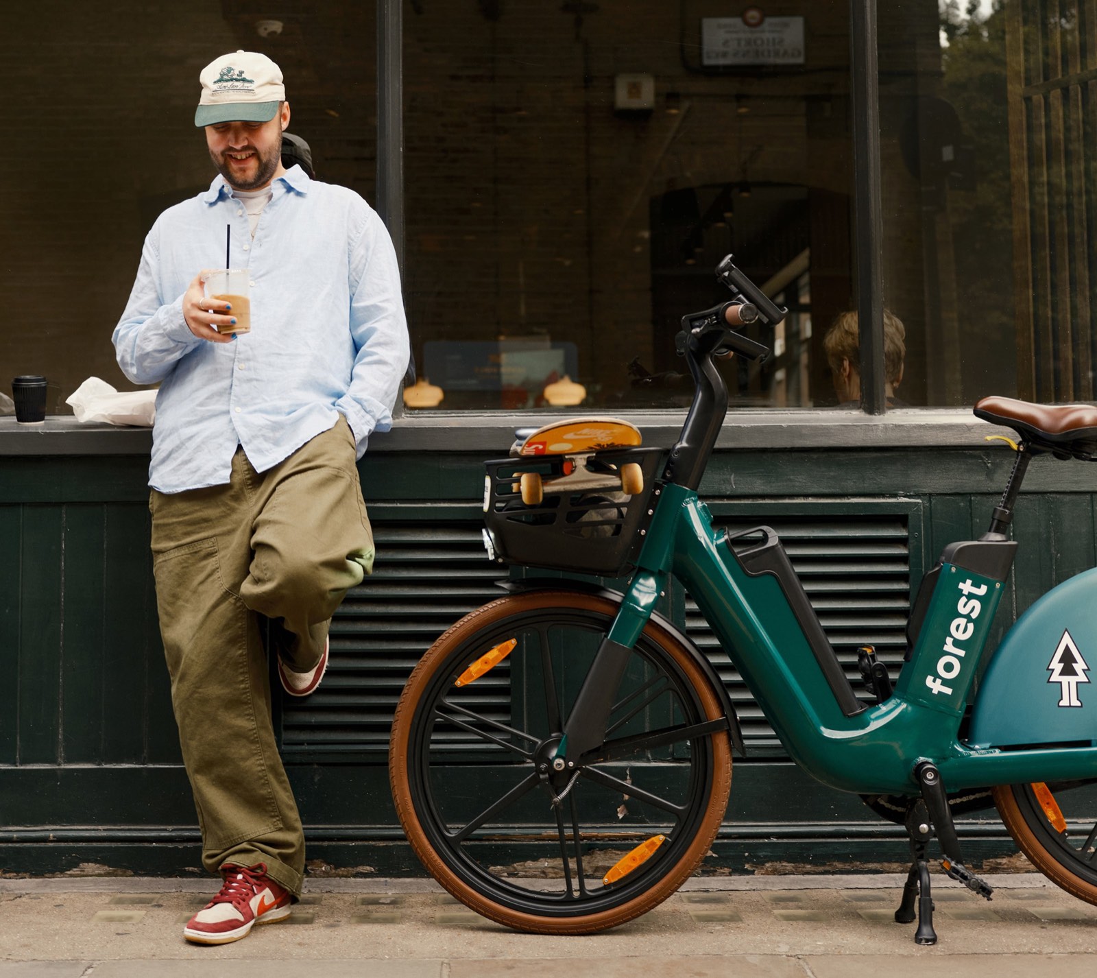 A rider with a Forest e-bike outside a London café